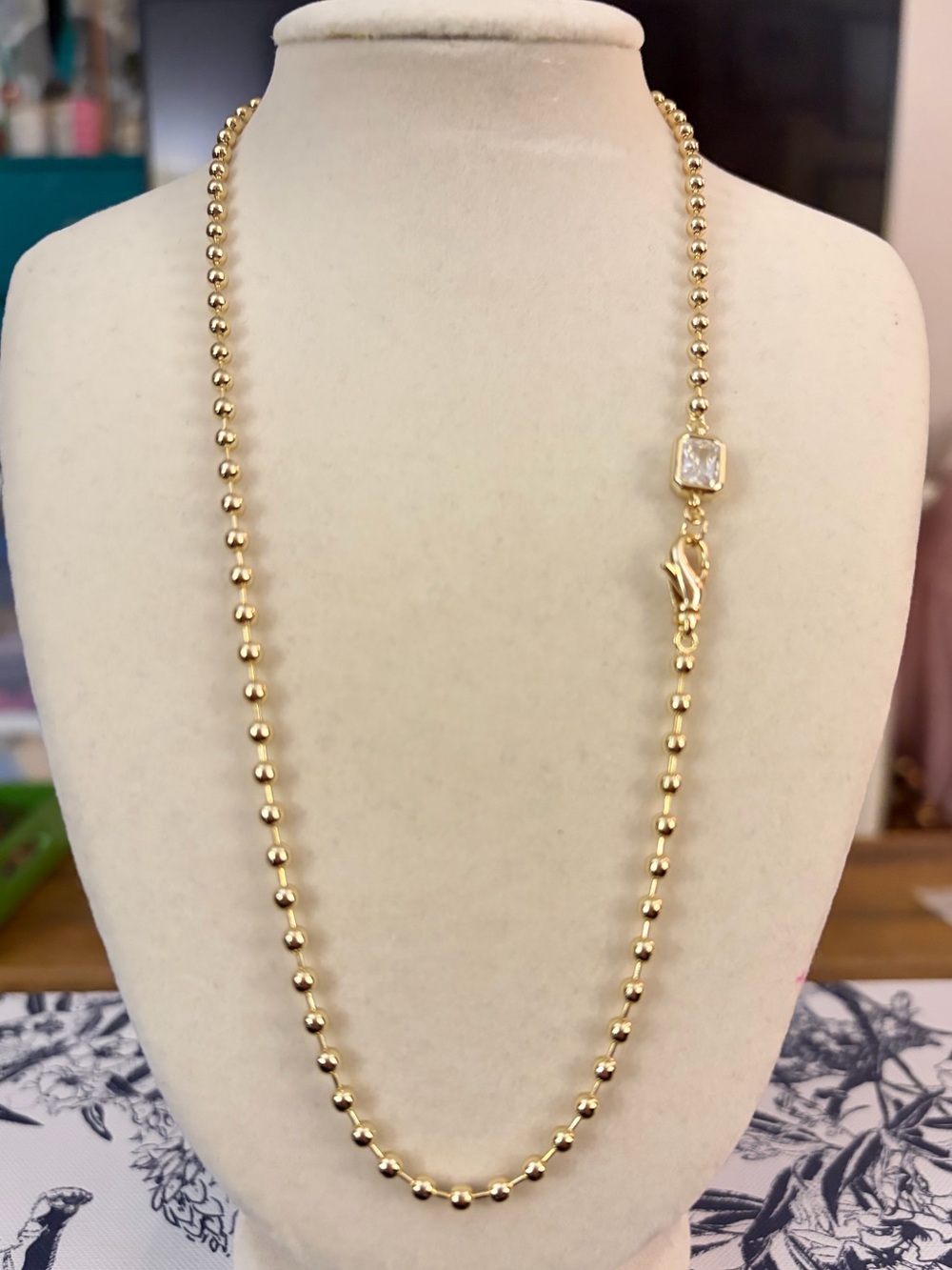 16” Luxe Gold Beaded Necklace with Crystal Clasp The ultimate cool-girl necklace